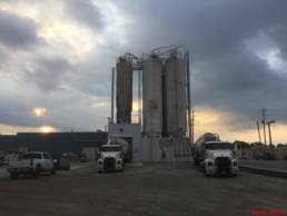 Grain elevator with trucks